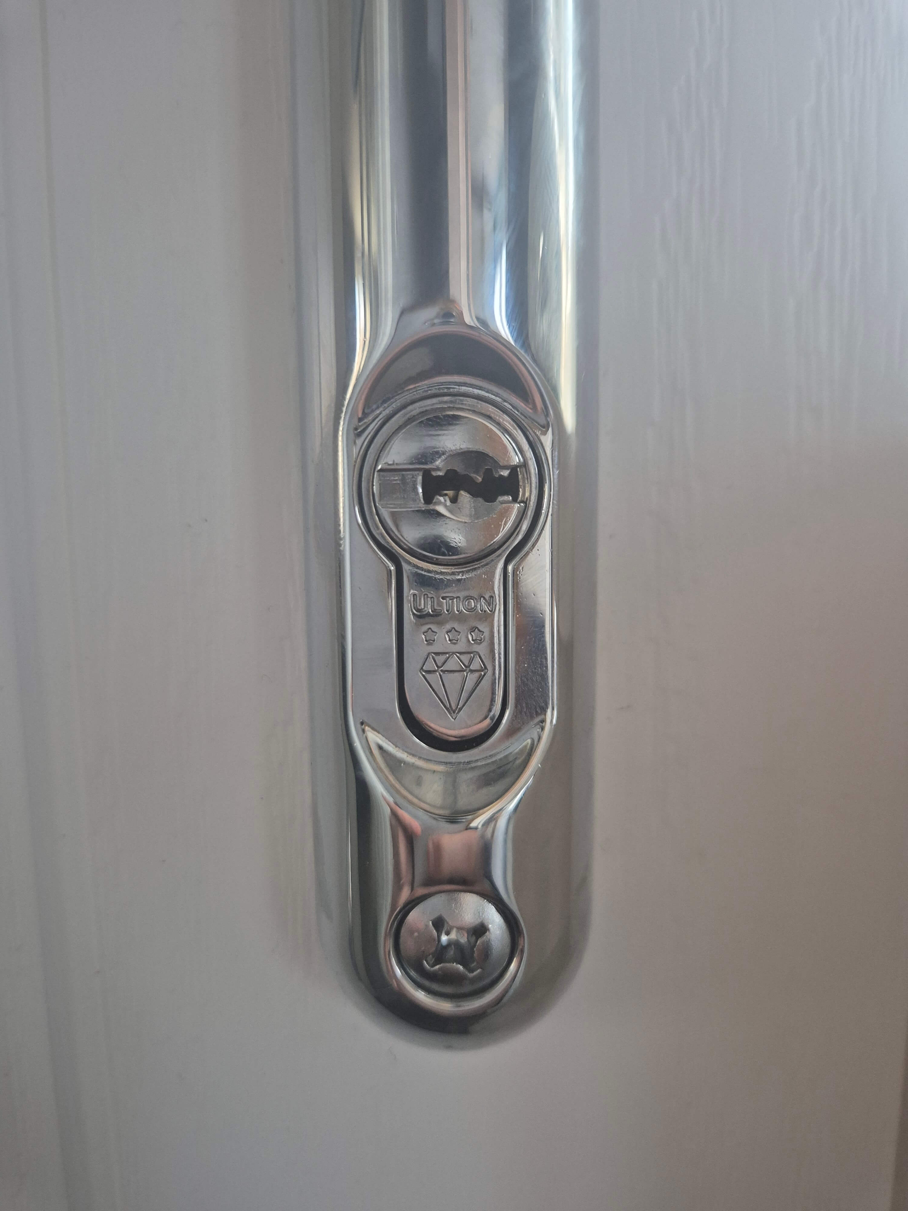 Ultion WXM anti snap lock fitted in chrome fitted to composite door with chrome door handle