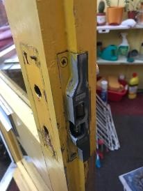Union sash lock fitted to yellow wooden door